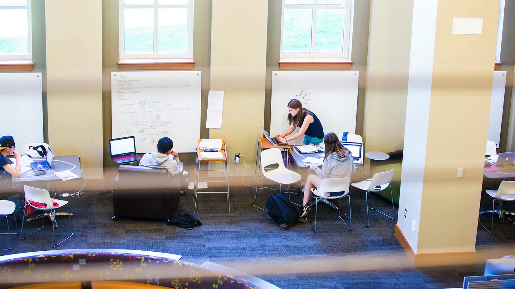 Students studying in the Oxford library.