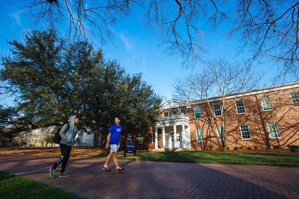 Two students walk past the newly renovated Pierce Hall.