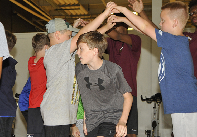 Campers play outdoor games at the Oxford sports camp.