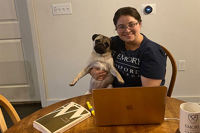 Oxford College faculty member Devon Goss (with her teaching assistant, Gigi the Pug)