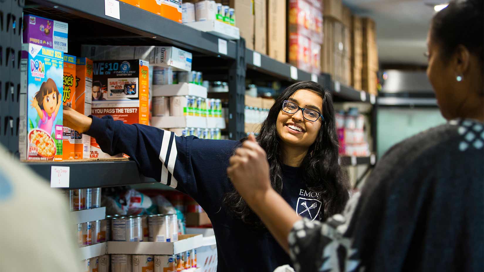 Oxford students assist clients at a local food bank.