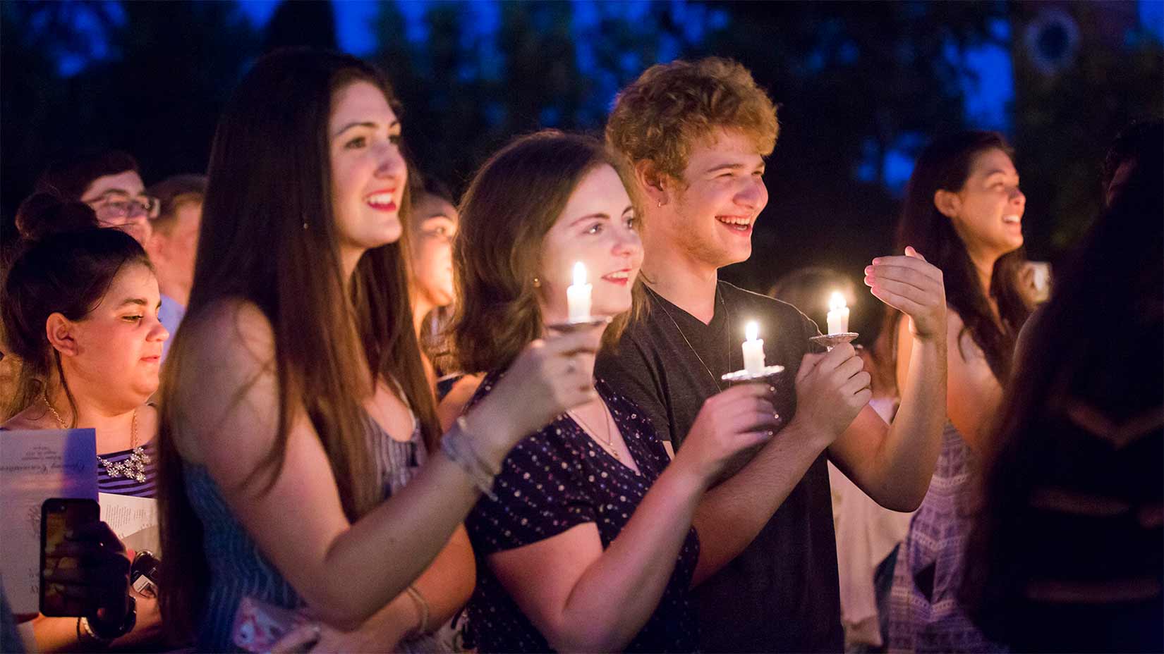 Students celebrate the opening of the school year with a traditional candlelight processional.