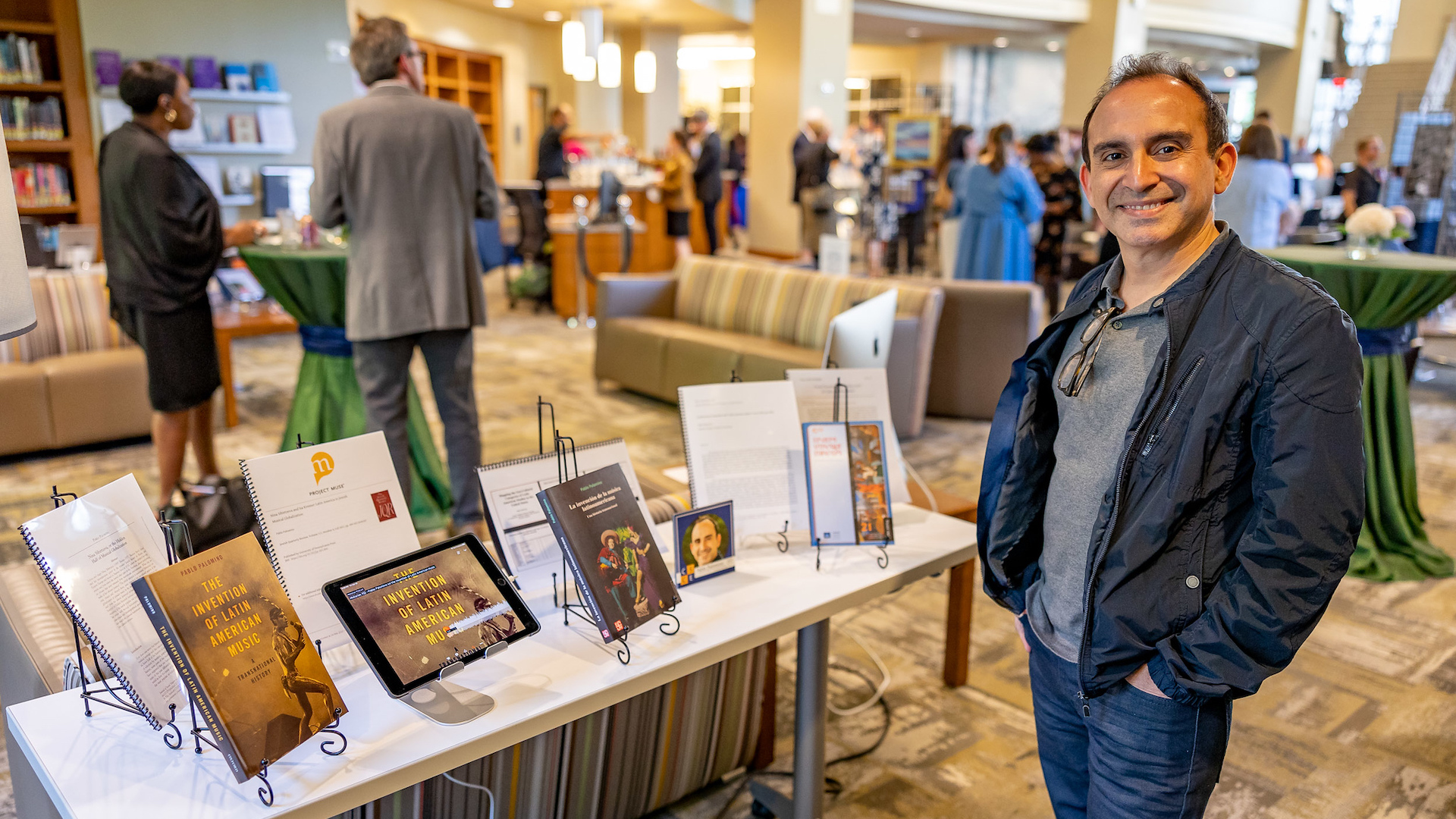 Pablo Palomino next to his publications at the 2022 CSCE.