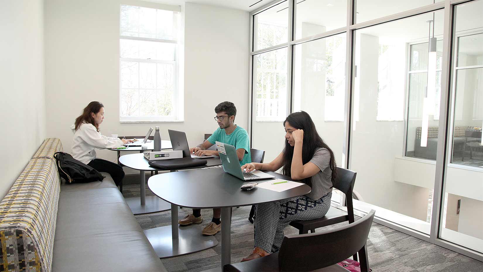 Students use their laptops in one of the Pierce Hall study rooms.