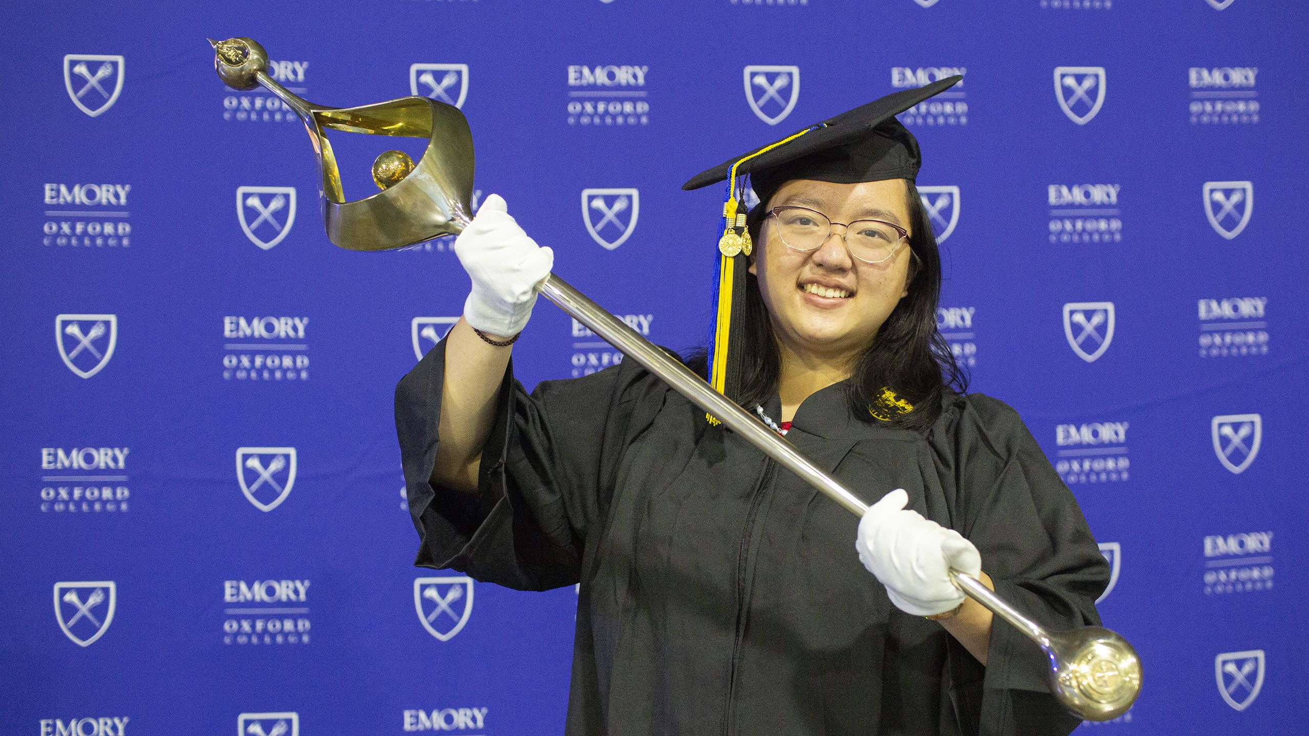 Eleanor Liu with the Oxford College mace.