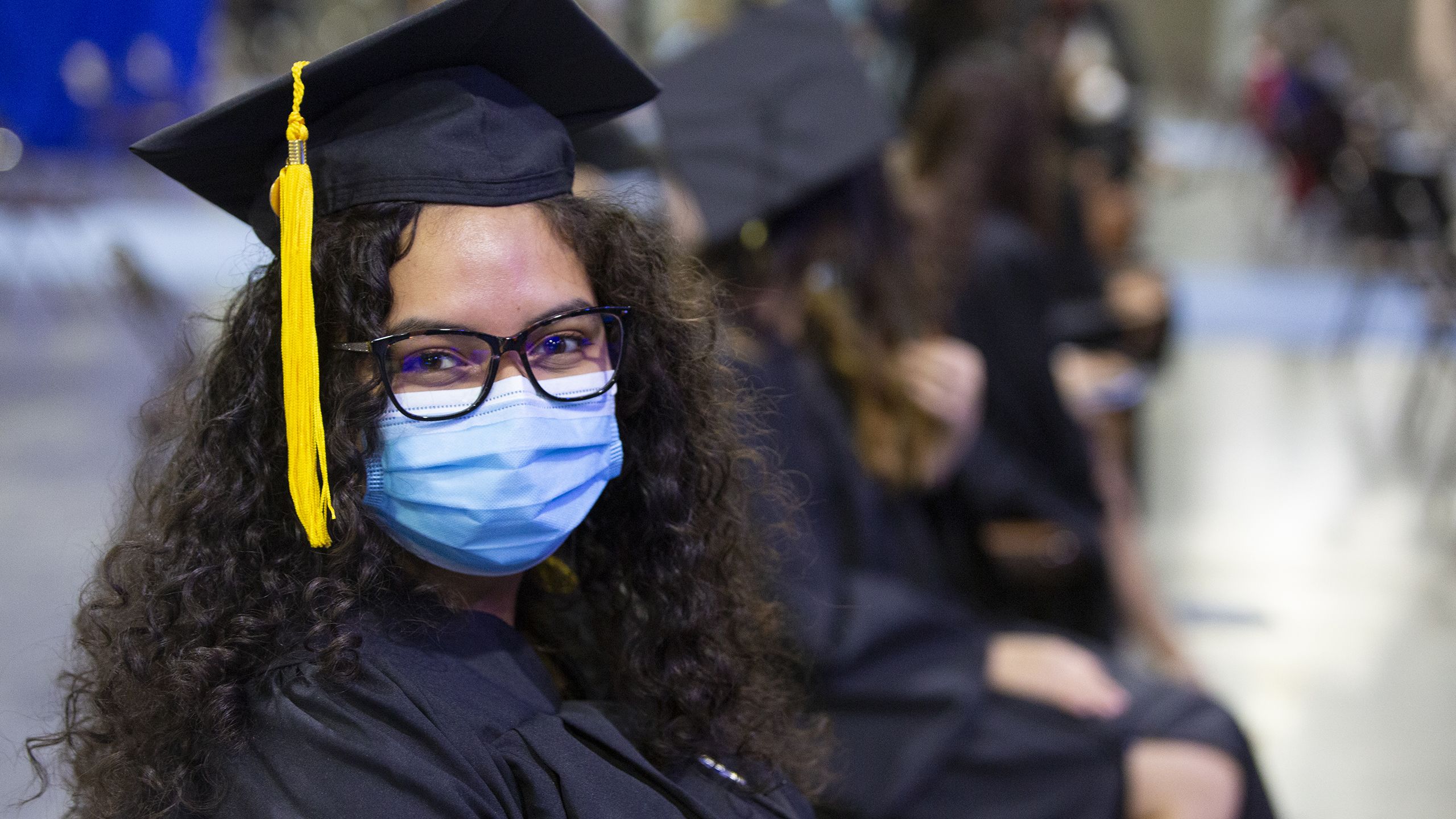 A masked Oxford student during the ceremony