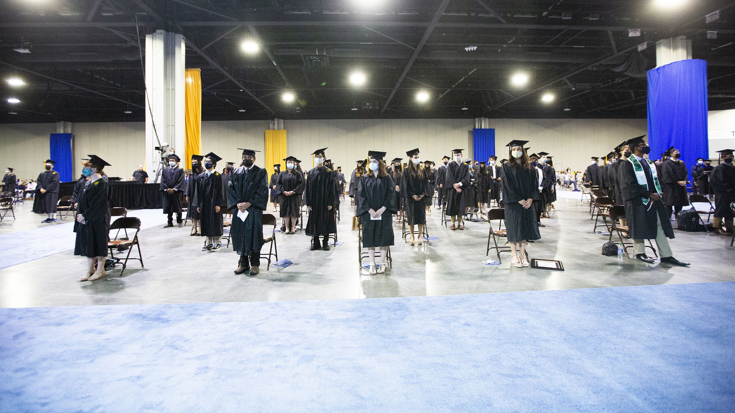 Students stand socially distanced during the ceremony.