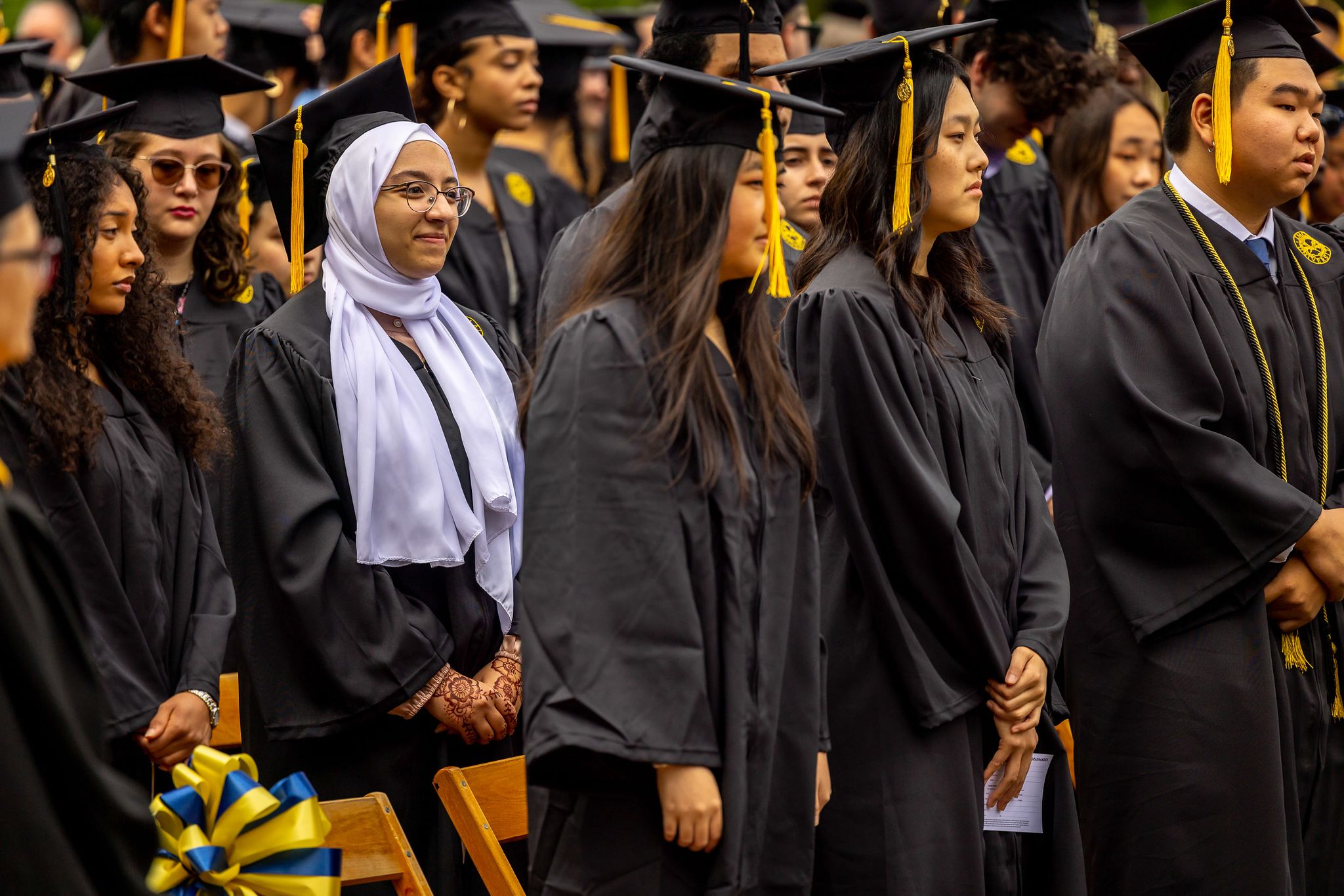 Oxford graduates ready to turn the tassels on their caps during the commencement ceremony.