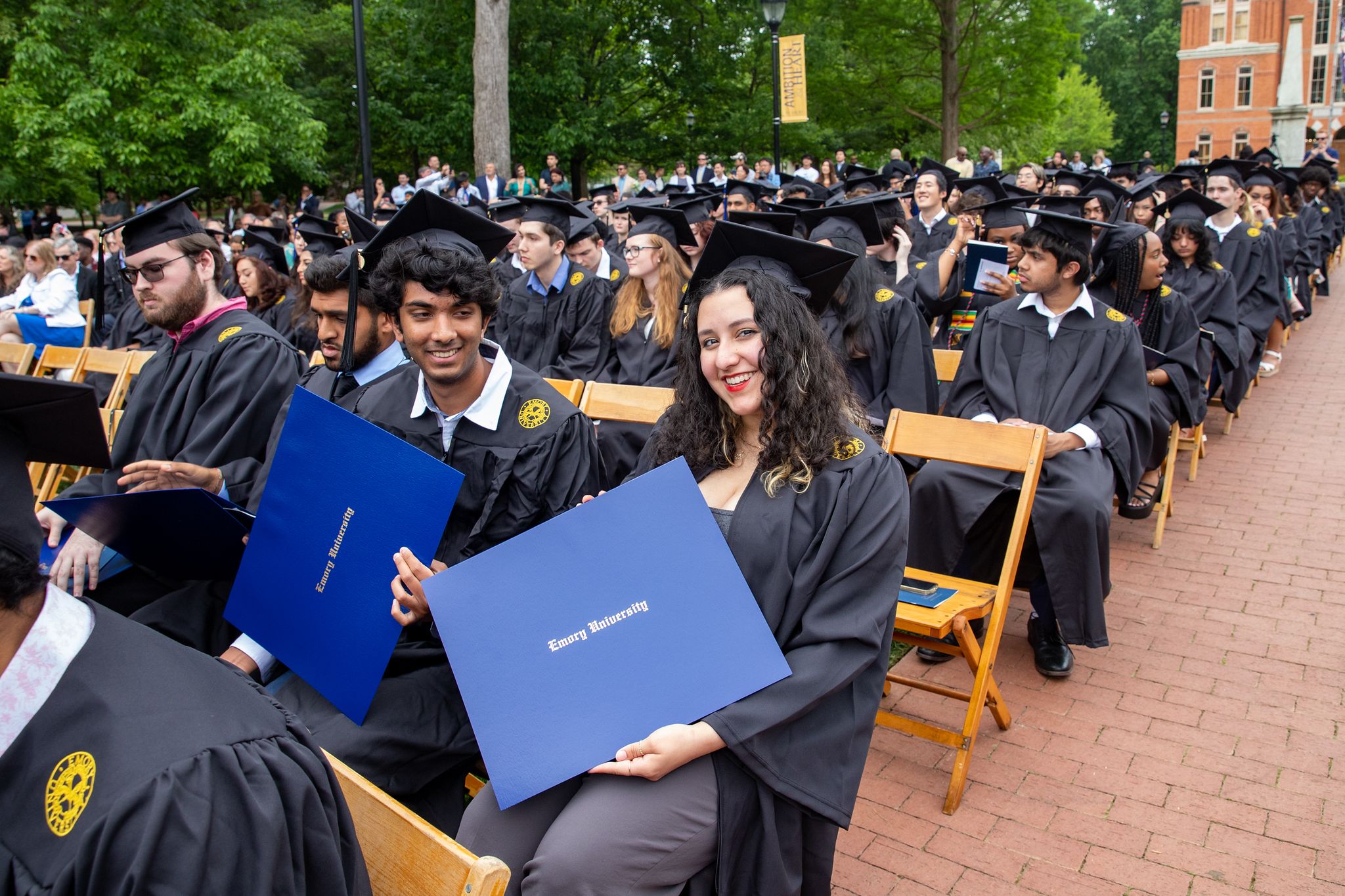 Oxford students posing with their diplomas.