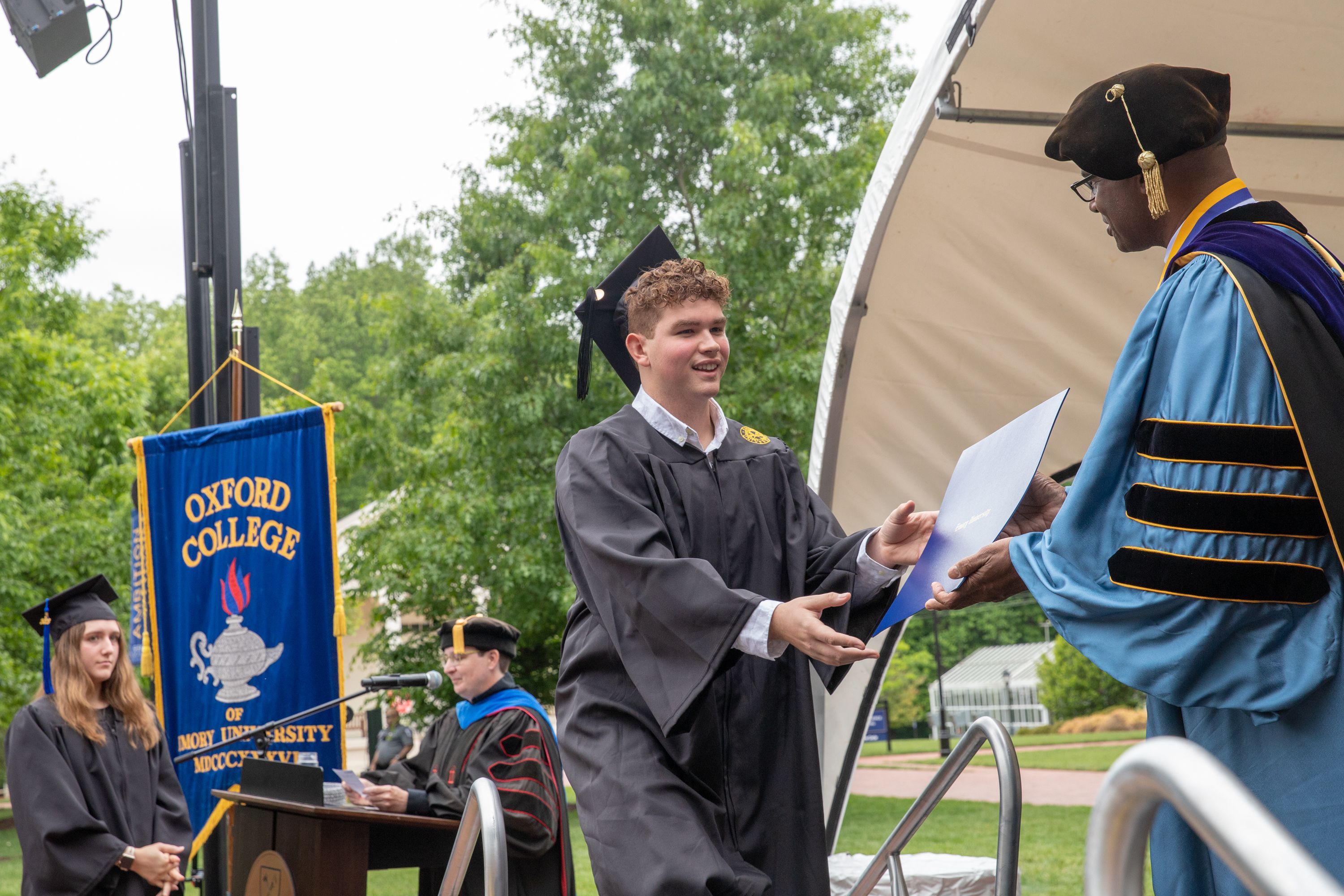 Interim Dean Ken Carter passes out degree at Oxford 2023 Commencement