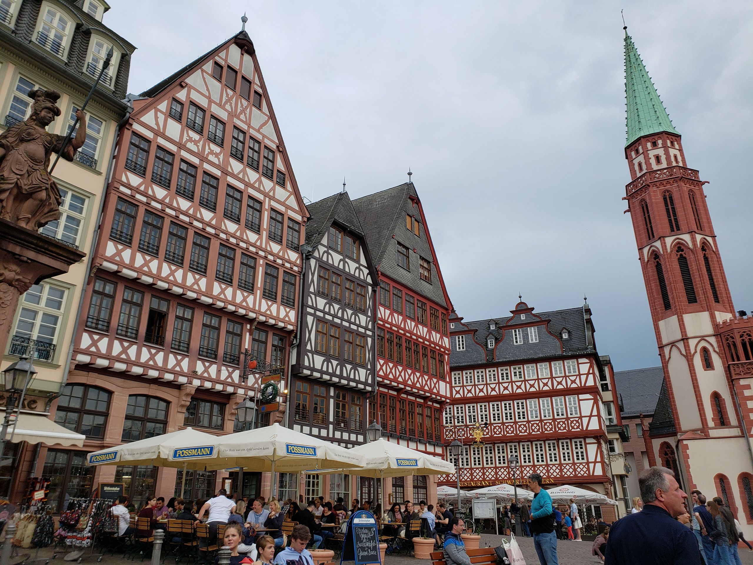 People enjoy outside dining in Frankfurt's Old Town central square.