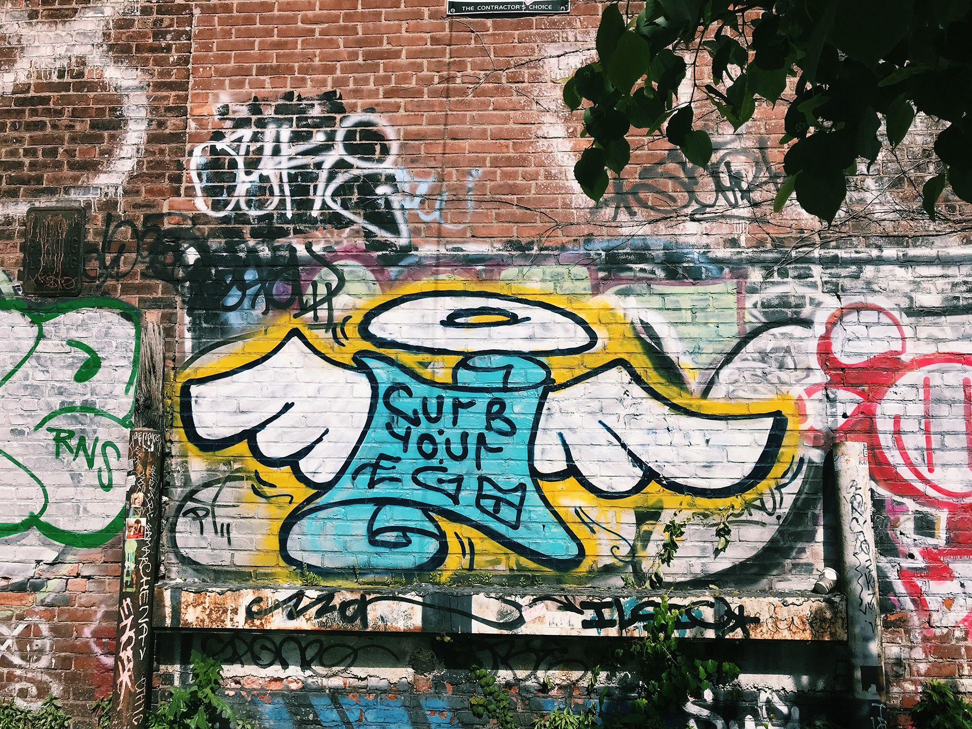 Street art tells passersby to Curb Your Ego.