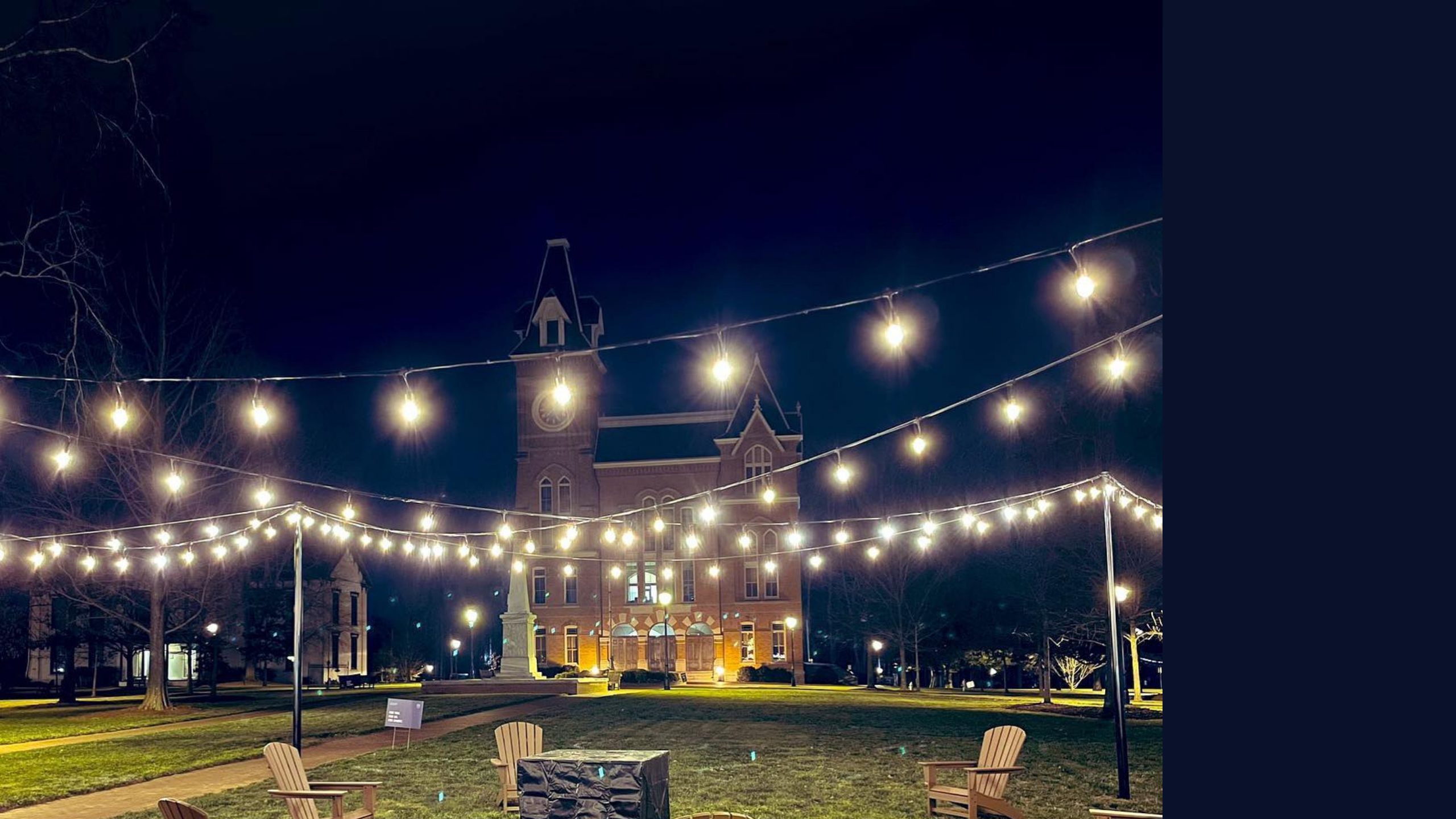 String lights in front of Seney Hall at night.