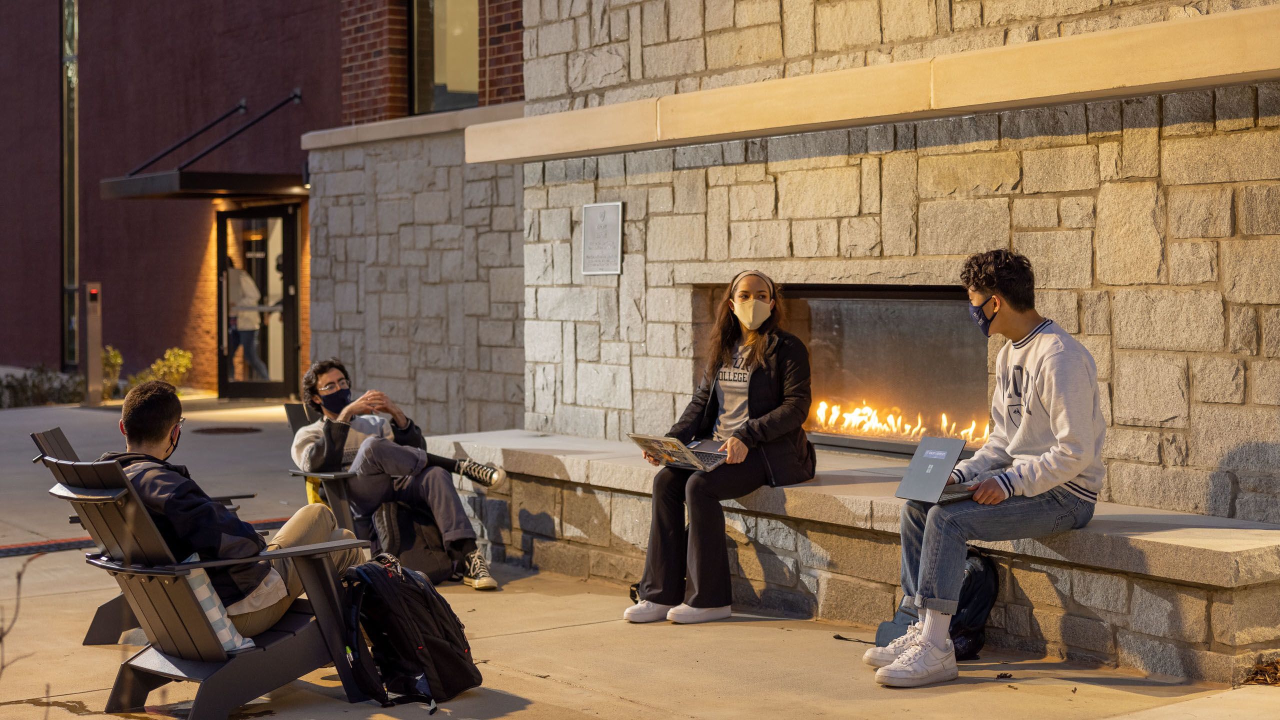 The outdoor fireplace at the Oxford Student Center provides places for students to gather outside.