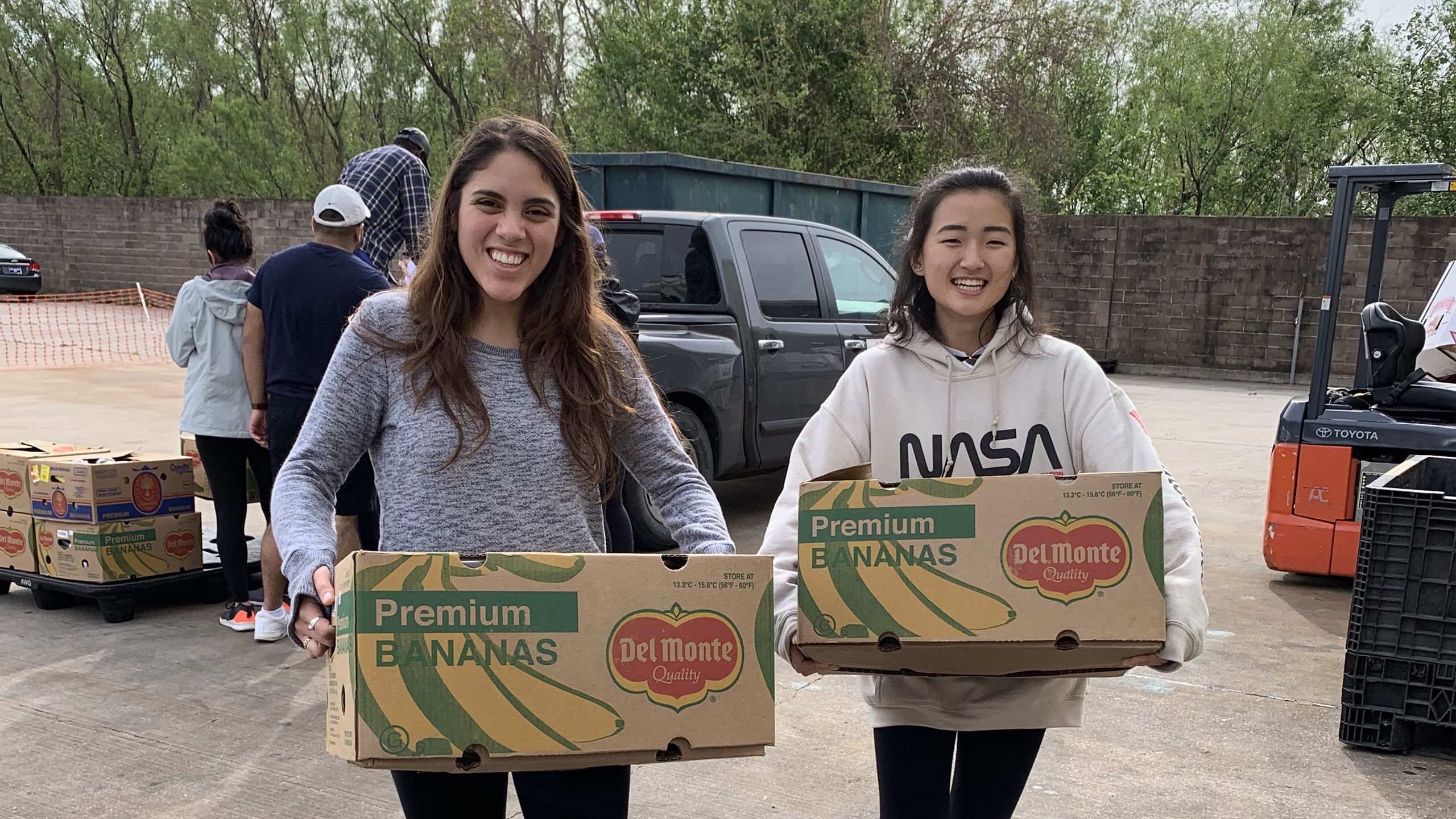 Oxford students help unload boxes of food at a New Orleans food pantry