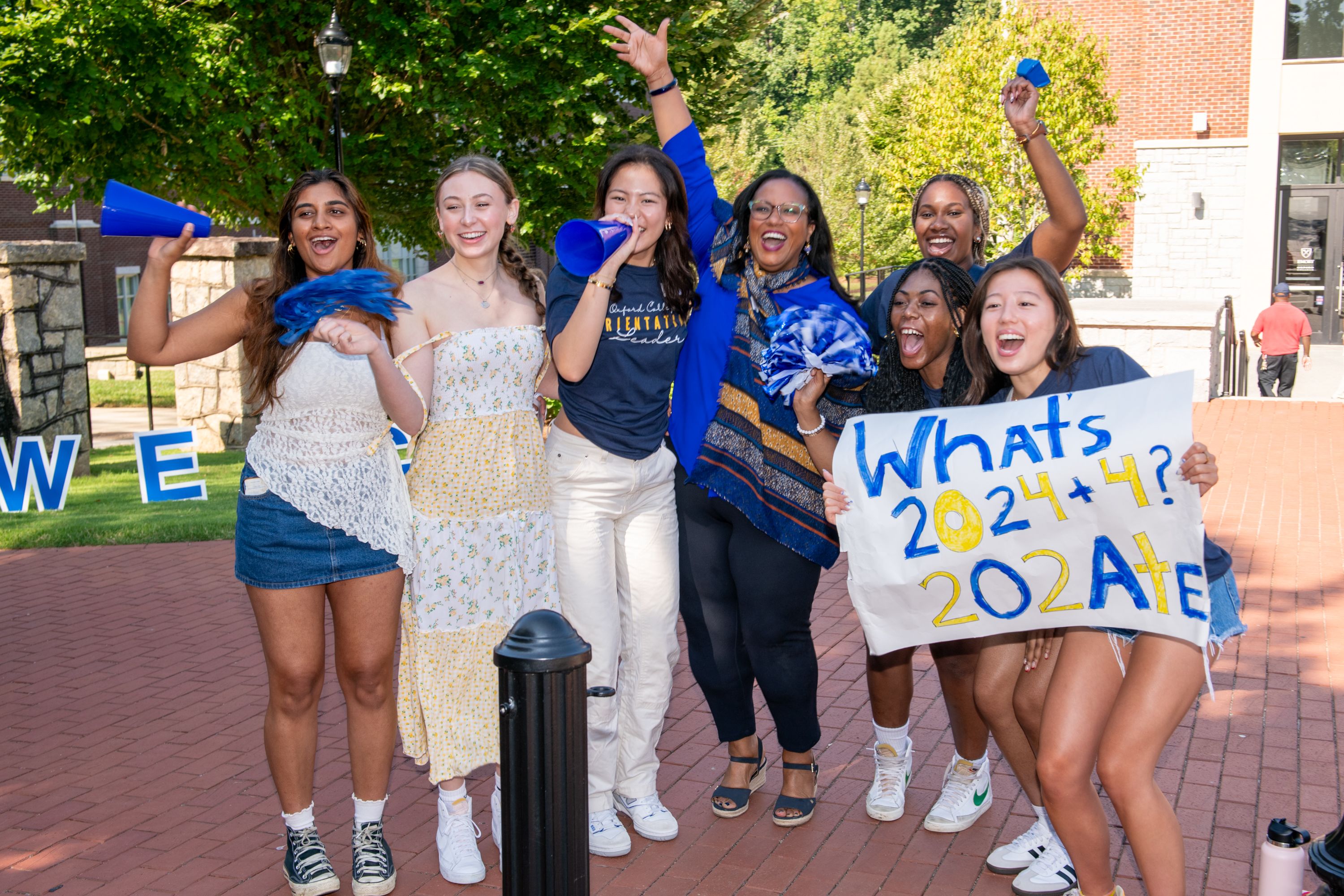 Orientation student leaders along with Darleny Cepin, senior associate dean of Campus Life, welcoming first-year students and their families.