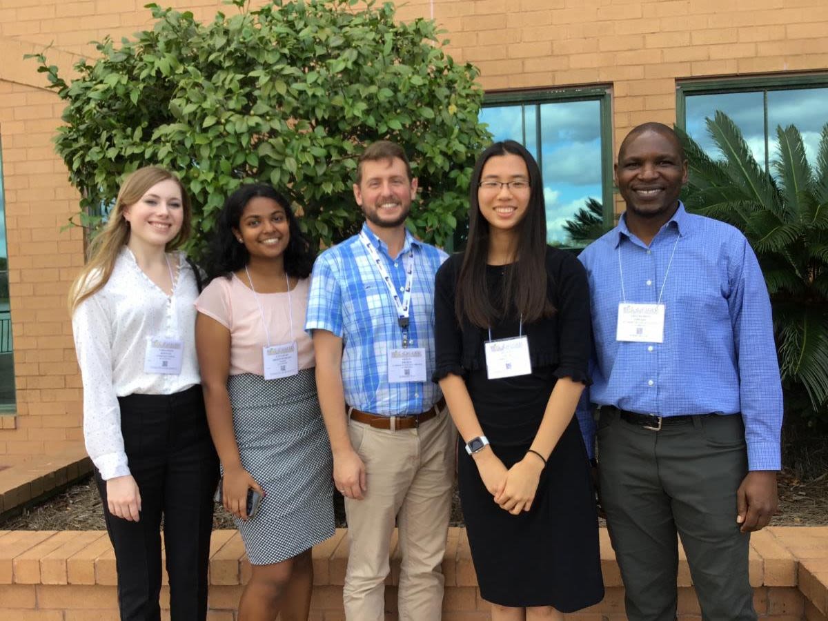 Maggie Gunter, Sharanya Thodupunoori, and Tiffany Hung (l-r) presented their research with Oxford faculty Austin Scharf (center) and Simbarashe Nkomo (far right).