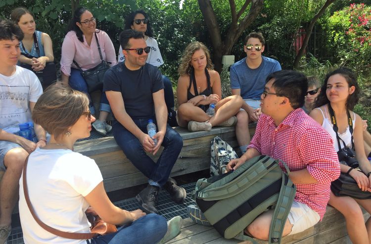 Oxford faculty members Erin Tarver and Joshua Mousie have a philosophy discussion with students on the site of Aristotle’s Lyceum in Athens.