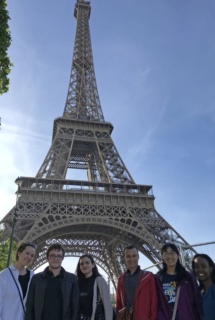 Students gather at the Eiffel Tower.